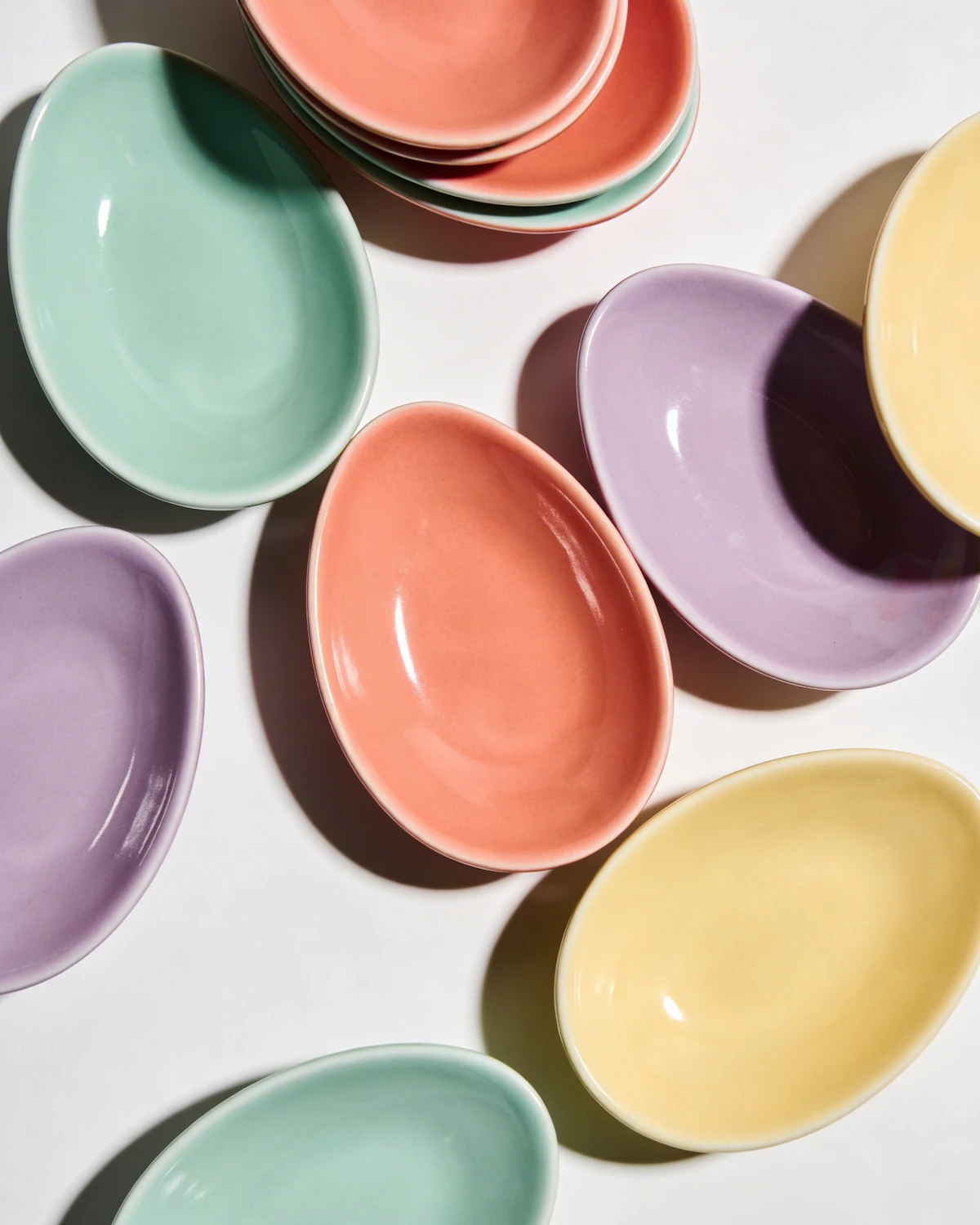 Pastel glazed ceramic bowls in mint, coral, lilac and butter yellow